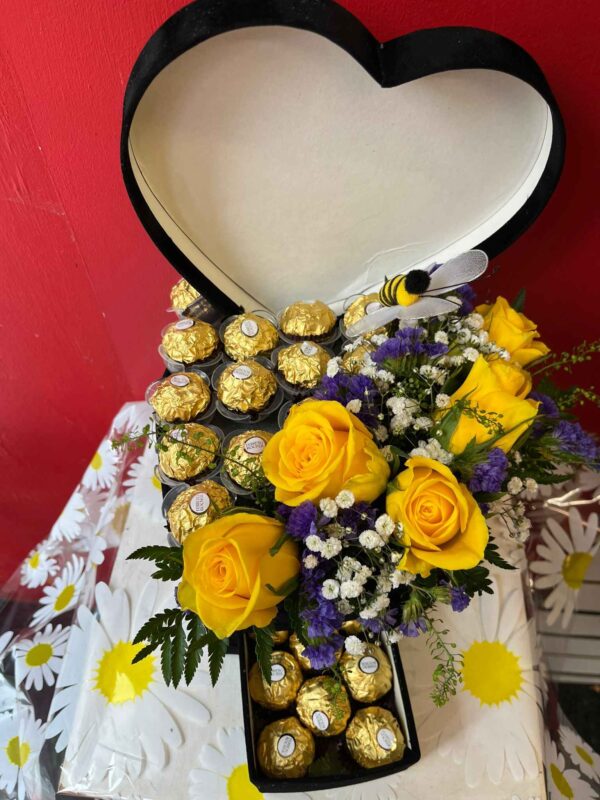 Heart shape hat fresh flowers and chocolate box