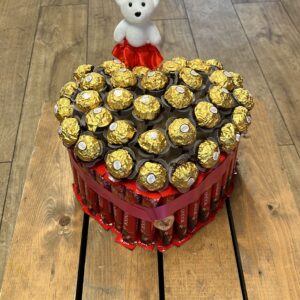 Lindor snd ferro Roche surround heart shaped box with teddy
