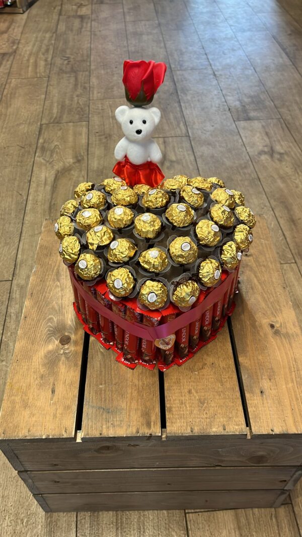 Lindor snd ferro Roche surround heart shaped box with teddy